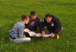 Briefing before departure, laying a course on the map